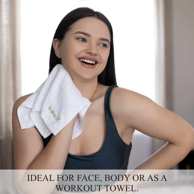 FEMALE USING SA BEAUTÉ 100% BAMBOO FIBER  WASHCLOTH TO DRY HER FACE AFTER WORKOUT.